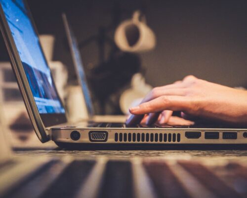 hands on a laptop typing